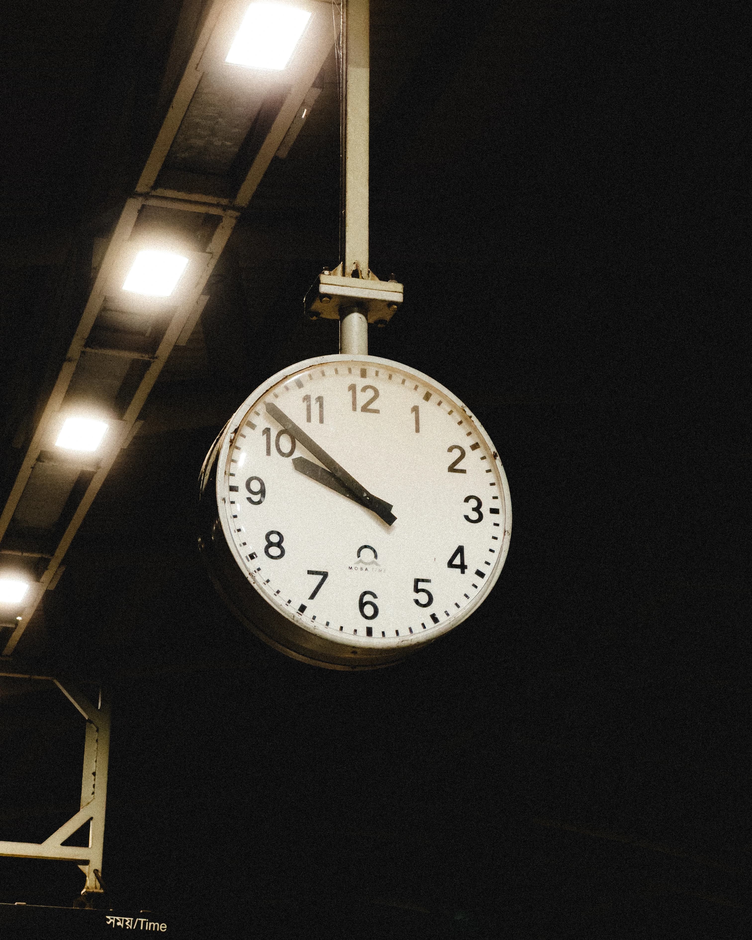 A ceiling clock at the metro station.